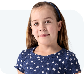 Cora, a person living with XLH, smiling
