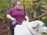 Karen, a person living with XLH, walking her dog